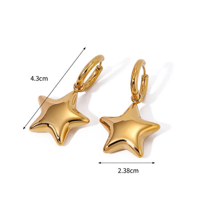 Gold star-shaped earrings with measurements on a white background
