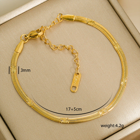 Gold stainless steel bracelet with measurements and weight details on a beige background