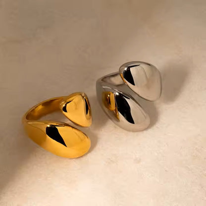 Gold and silver rings on a beige background