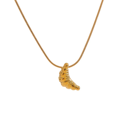 Gold stainless steel necklace with a unique pendant on a white background