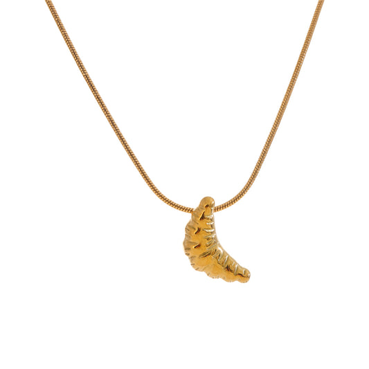 Gold stainless steel necklace with a unique pendant on a white background