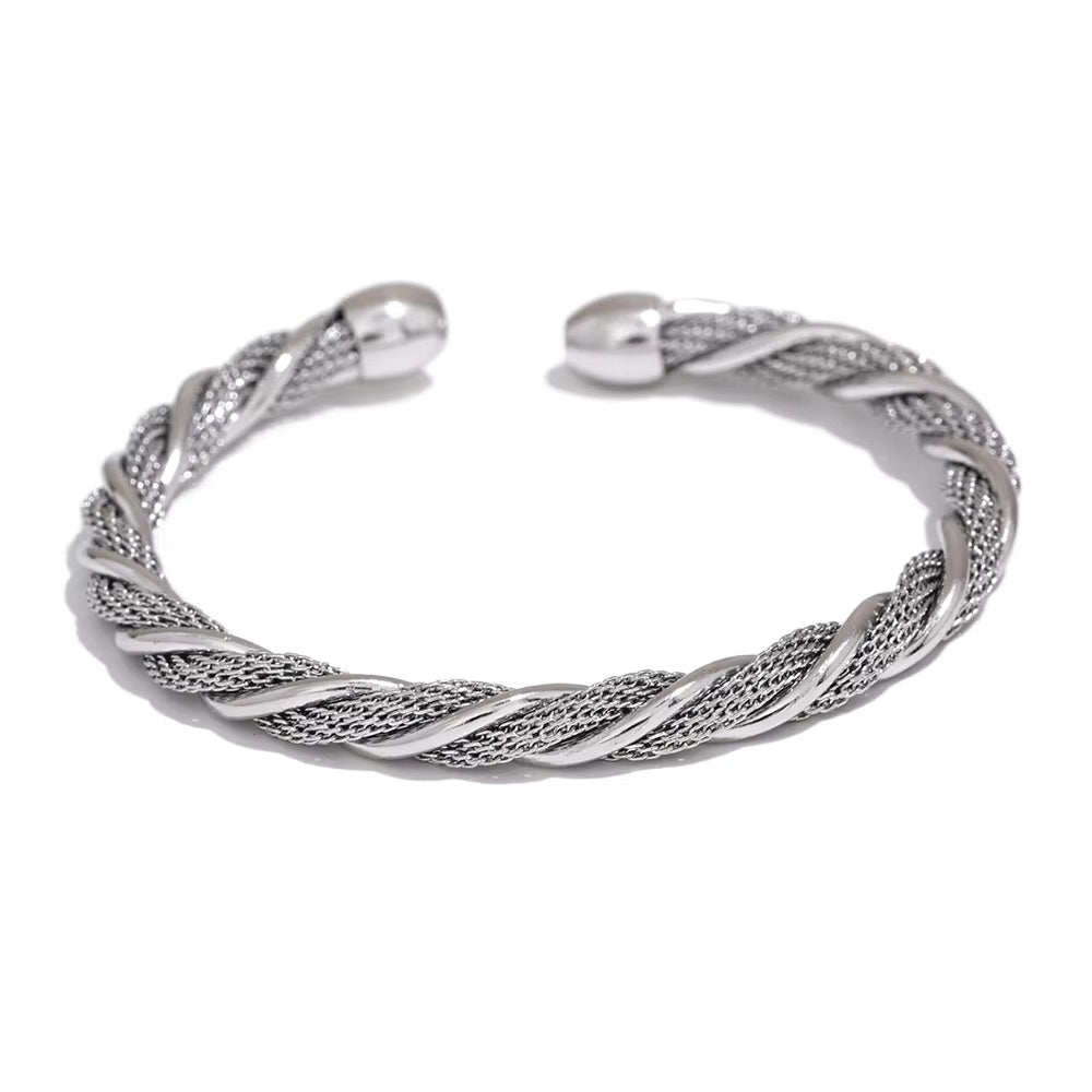 Silver braided bangle on a white background