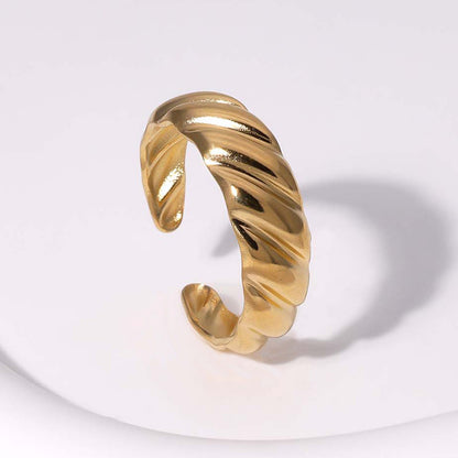gold waterproof ring with twisted design