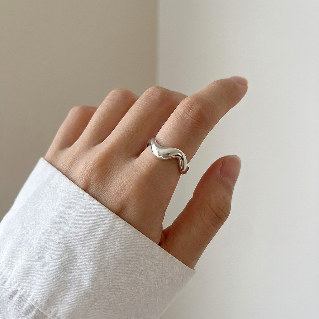 silver stainless steel ring on a hand