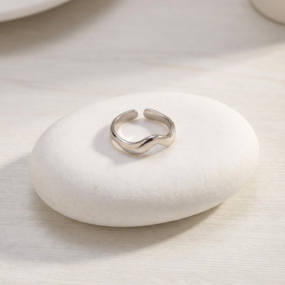 silver waterproof ring on a white stone