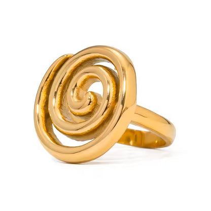 Gold spiral ring on a white background