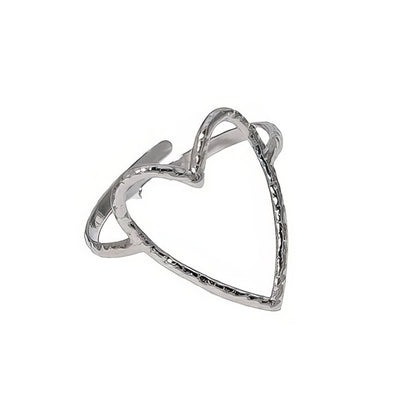 Silver heart-shaped ring on a white background